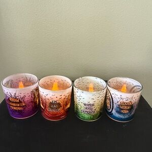 Disney Halloween Set Of Four Votive Cups .
Battery Operated Candles Included.